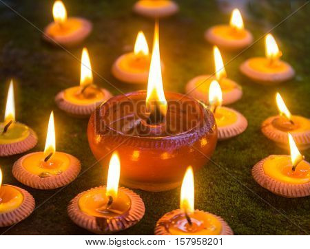 Orange Candle and beeswax warm light in dark
