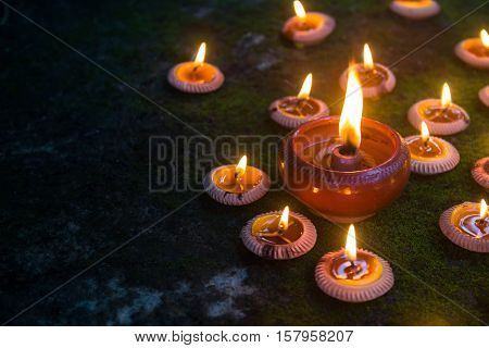 Orange Candle and beeswax  warm light in dark,