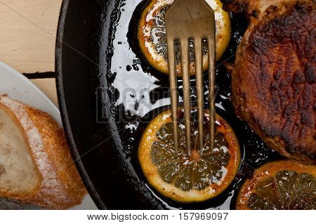 Pork Chop Seared On Iron Skillet