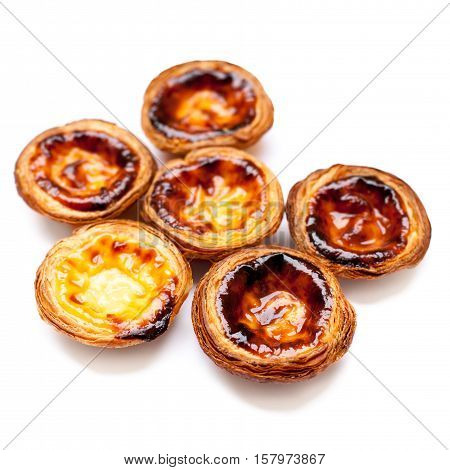 Typical portuguese dessert pasteis de nata isolated on white background close up