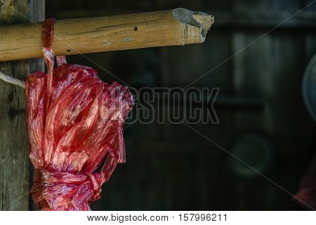 Red plastic rope rope on blur barn background