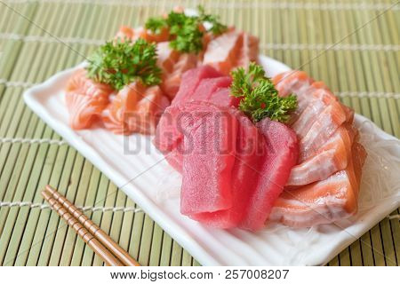 Mixed Sliced Fish Sashimi On Ice In White Plate. Sashimi Salmon And Tuna Set, Raw Fish, Japanese Foo