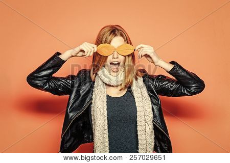 Woman With Autumn Leaves As Glasses In Leather Jacket. Girl With Orange Leaves. Season And Autumn Ho