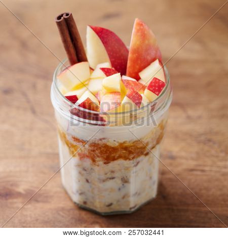Overnight Oats, Bircher Muesli With Apple, Cinnamon And Honey. Wooden Background. Close Up