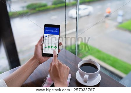 Chiang Mai, Thailand - August 18,2018: Woman Hands Holding Huawei With Onedrive On Screen. Microsoft