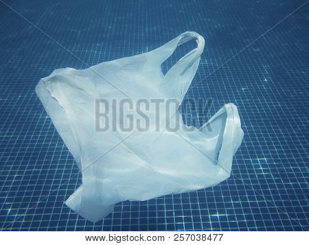 Plastic Bag Floating Into The Water. Polluted Enviromental. Recycle Garbage