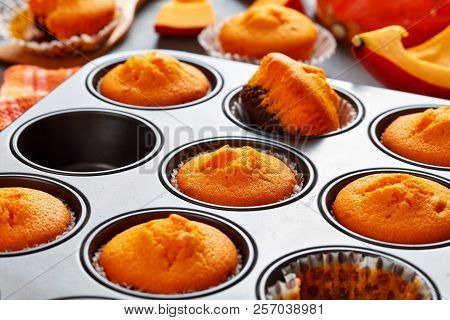 Close-up Of Freshly Baked Homemade Sweet Pumpkin Muffins In A Baking Mold On A Rustic Wooden Table, 