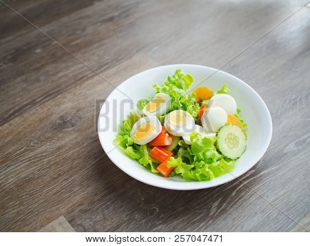 Healthy Bowl Of Homemade Salad With Fresh Vegetables, Crab Stick, Eggs