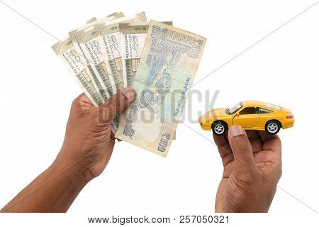 Indian Currency Notes And Toy Car In The Hands Bank Loan Concept