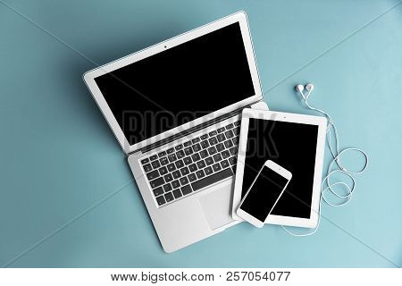 Devices With Blank Screens On Color Background, Top View. Mock Up For Design