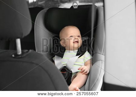Little Baby In Child Safety Seat Inside Of Car