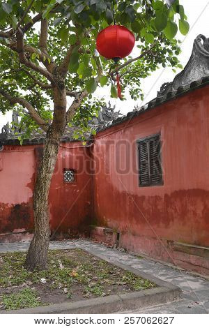 The Tree In Front Of An Old Histroic Traditional Building In The Unesco Listed Central Vietnamese To
