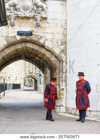 London, United Kingdom - June 09, 2013: Beefeaters Near Walls Of The Tower Of London. Beefeaters Or 