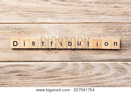 Distribution Word Written On Wood Block. Distribution Text On Table, Concept.