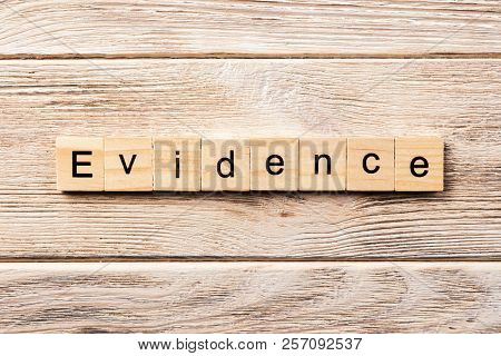 Evidence Word Written On Wood Block. Evidence Text On Table, Concept.