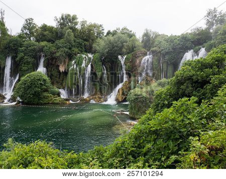 Beautiful Kravica Waterfall In Bosnia And Herzegovina - Popular Swimming And Picnic Area For Tourist