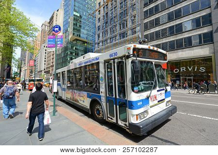 New York City - May 7, 2013: Mta Hybrid Electric Bus Route 5 On Fifth Avenue At 42nd Street, New Yor