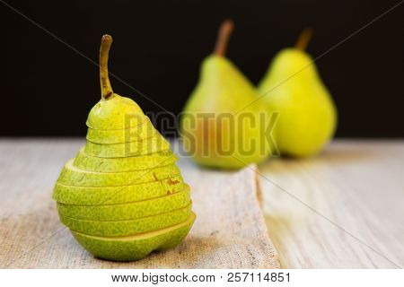 Sliced Fresh Pear On Cloth, Closeup. Side View.