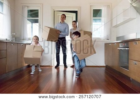 Happy Little Kids Run With Boxes Into New Bought House