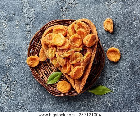 Dried Apricots On Gray Concrete Background. Top View.