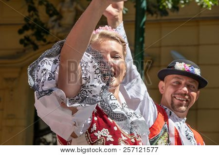 Prague, Czech Republic - July 1, 2018: People In Moravian Folk Costumes Parading At Sokolsky Slet, A