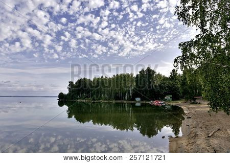 Bright Clouds Reflected In The Water, South Ural Lake Uvildy