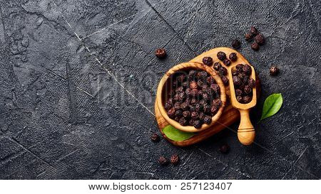 Dried Hawthorn Fruits On Black Background. Top View Of Crataegi Fructus.