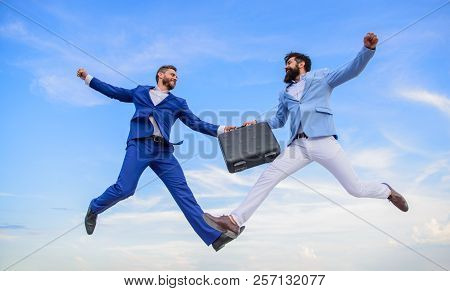 Successful Transaction Between Businessmen. Briefcase Handover In Heaven Blue Sky Background. Easy D