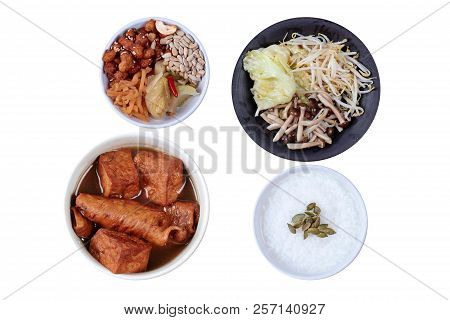 Chinese Vegetable Festival As Rice Gruel  Fried Tofu And Fermented Flour In Brown Soup And Fried Mix