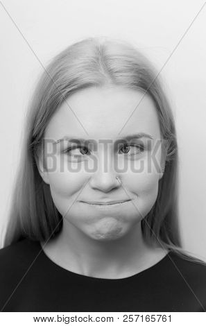 Woman Squinting Eyes And Puffing Cheeks On Funny Face. Cute Girl With Crossed Grey Eyes, Healthy Ski