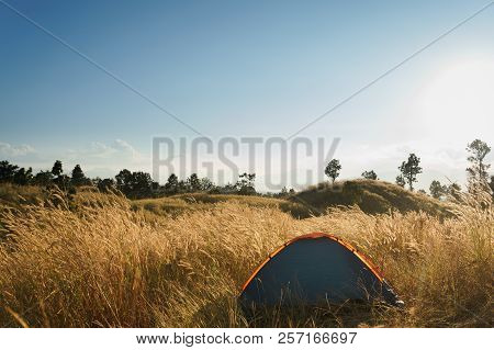 Outdoors Camping Grass Highlands Mountain In The Sunset.