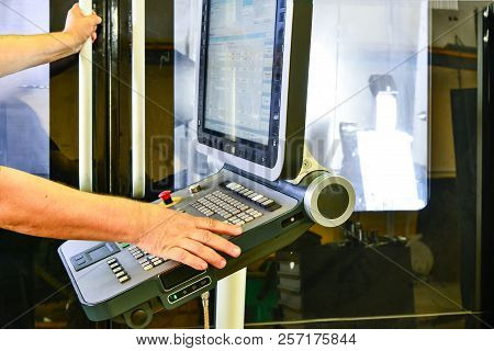 Worker, Operator Of The Control Panel Of The Program Of Operation Of A High-precision Cnc Machining 