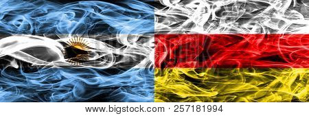 Argentina Vs South Ossetia Smoke Flags Placed Side By Side. Thick Colored Silky Smoke Flags Of Argen