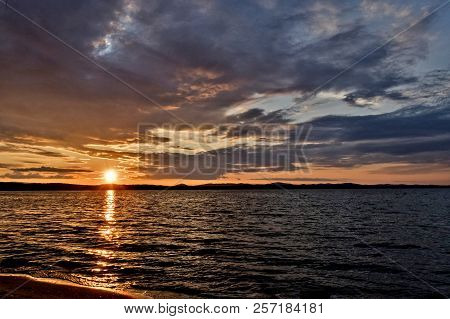 Golden Sun Sinks Over The Lake In The Evening, Golden Water, South Ural Lake Uvildy