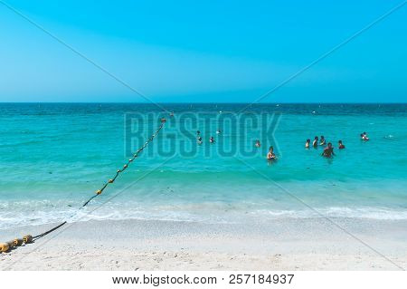 Dubai, Uae United Arab Emirates - 23 April 2016:view Of Public Beach With Turquoise Water In Al Mamz