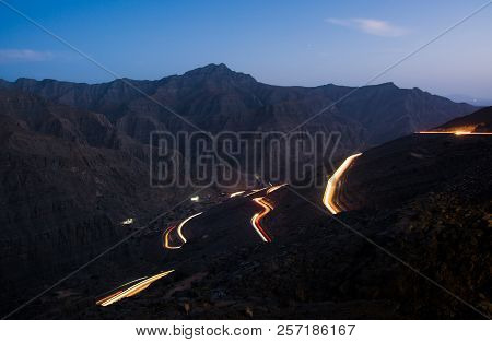 Light Trails On Jabal Jais Mountain Road At Night, Uae