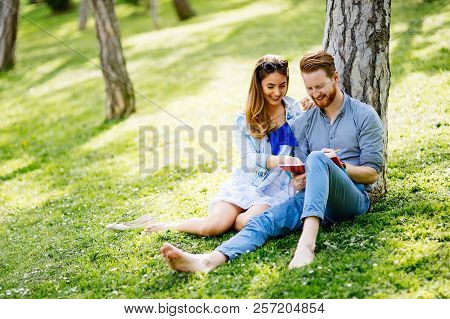 Lovely University Students Studying Outdoors In Park