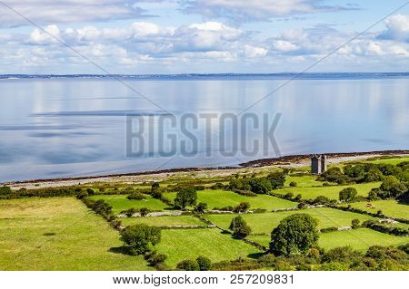 Old Rock Tower, Farm And Beach In Ballyvaughan