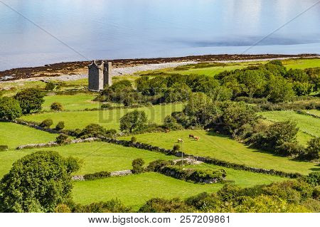 Old Rock Tower, Farm And Beach In Ballyvaughan