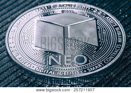 Neo Cryptocurrency Coin On Grey Shiny Background.