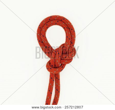 Double Bowline Knot On The White Background; Red Touristic Rope With Knot.