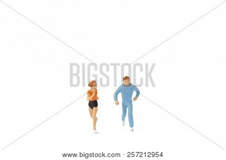 Miniature People : Couple Running On White Background , Healthy Lifestyle And Sport Concepts.