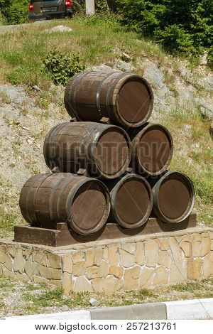 Advertising Design From Old Oak Barrels On The Edge Of Vineyards And Winery. Countryside Of Russia A