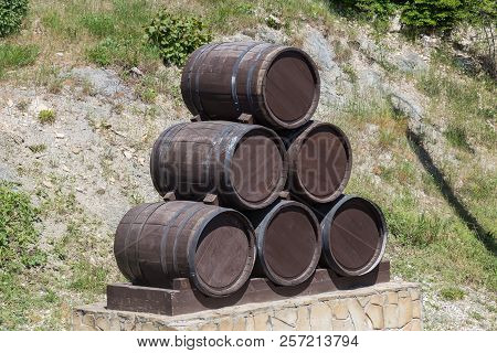 Advertising Design From Old Oak Barrels On The Edge Of Vineyards And Winery. Countryside Of Russia A