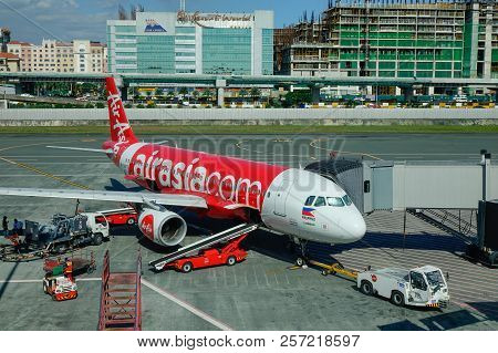Passenger Airplane Docking At The Airport