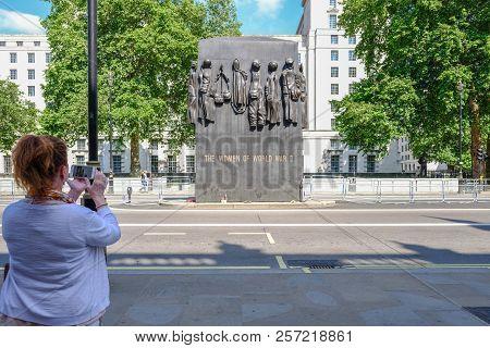 Whitehall, London, Uk - June 8, 2018: Lady Taking A Photo With Her Mobile Of The Monument For Women 