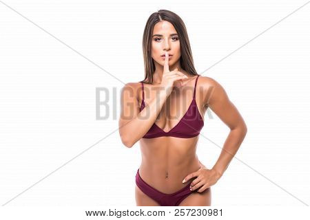 Woman Requires Silence. Young Beautiful Woman In Bikini Put Forefinger To Lips As Sign Of Silence