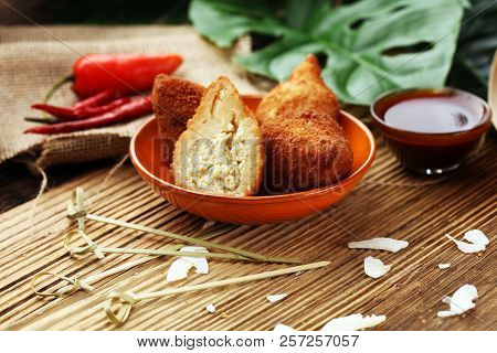 Coxinha Street Food. Brazilian Chicken Coxinha Over Rustic Background.