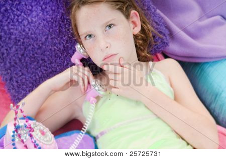 Young girl thinking seriously on  phone