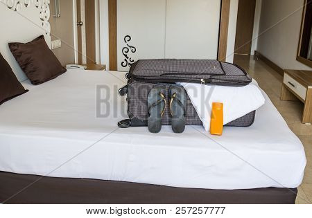 Coming To Hotel Room And Unpacking. Summer Vacation Concept